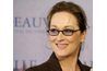 Actrice Meryl Streep's brown frames match both her hair and her outfit.